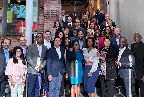 The 2023 DLIP Cohort 2 graduating class is joined by the DLIP sponsors, co-leads and partners in the Powerhouse Museum in New Brunswick, NJ.